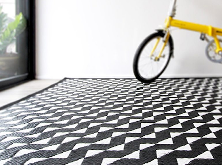Hit up Hit Van for stylish rugs at a steal. We've got our eyes on this Stride indoor/outdoor mat by PDM Brand, for just $159.